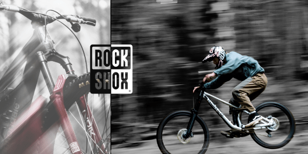 Mountain biker με ανάρτηση RockShox σε γρήγορη δασική διαδρομή